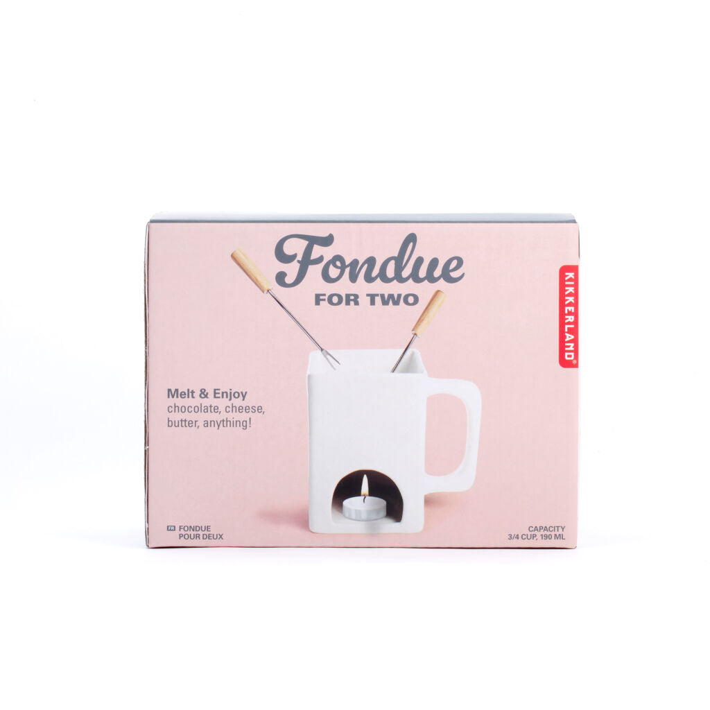 White ceramic fondue pot with two forks, in its pink box.  The box indicates it's for two people and has a 190ml capacity.