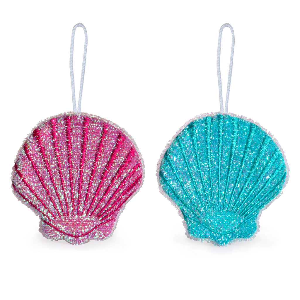 Pair of glittery pink and teal seashell ornaments with white cords.