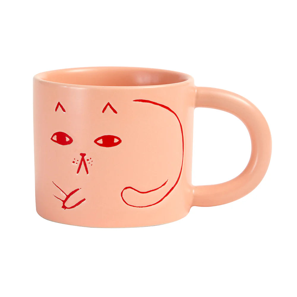 Pink mug with a face drawing on a white background