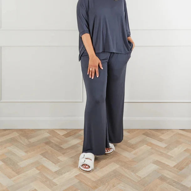 Dark gray wide-leg lounge pants and matching short-sleeved top.