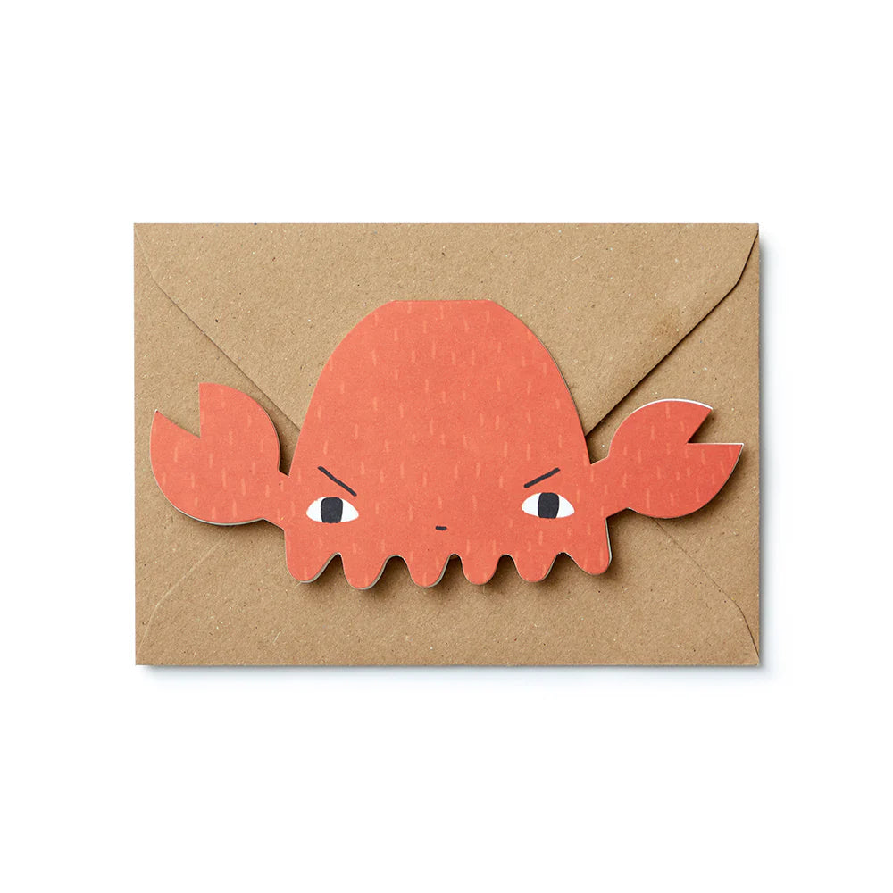 Orange crab illustration on a brown kraft envelope, featuring the Donna Wilson brand.