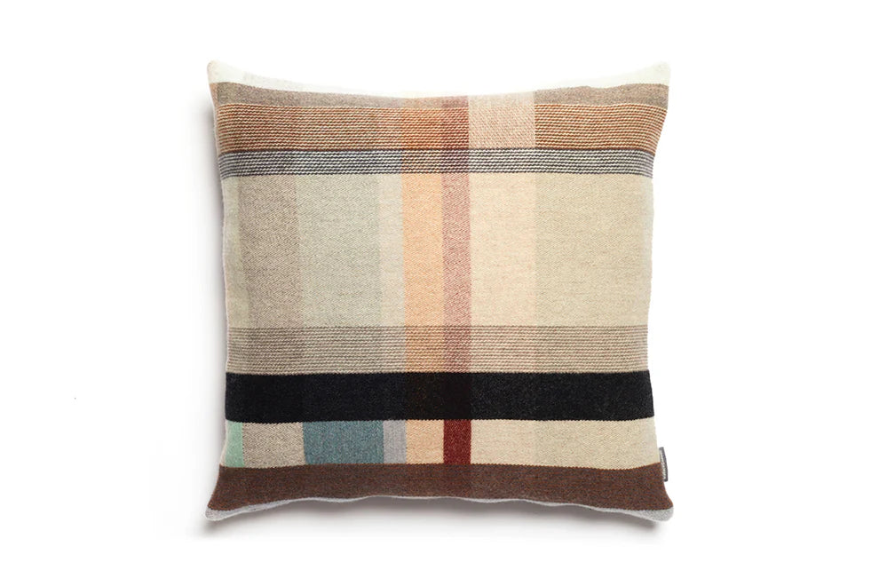 Checkered pillow with brown, beige, and blue stripes on a white background