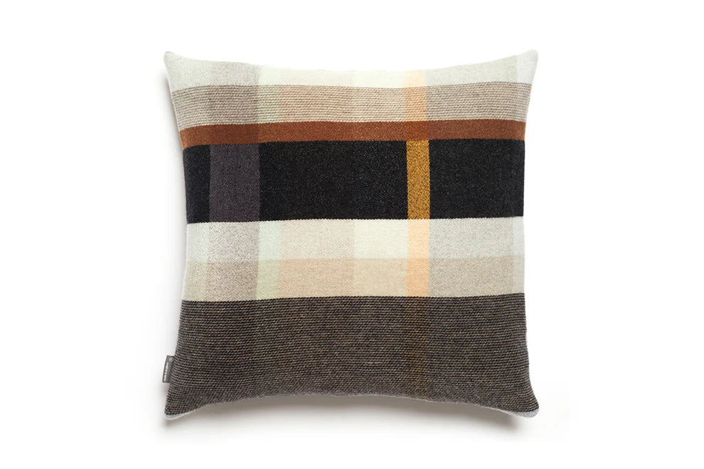 Plaid patterned pillow on a white background