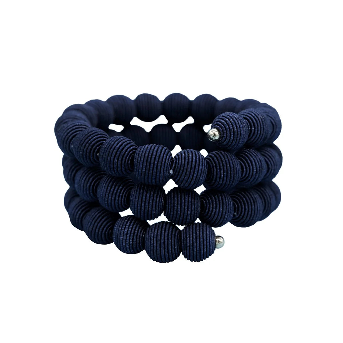 Navy blue fabric beaded bracelet; three rows of textured spherical beads spiral around.