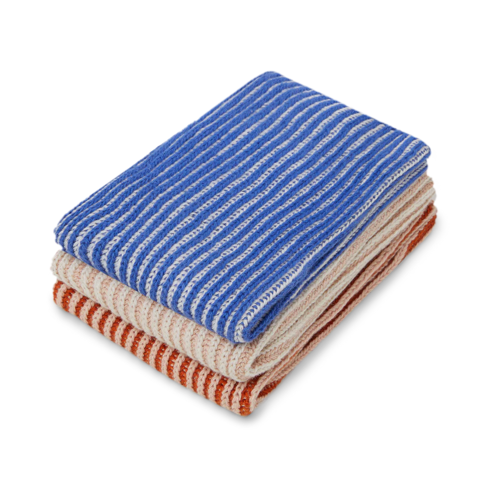 Stack of three striped knitted scarves in blue, beige, and orange.