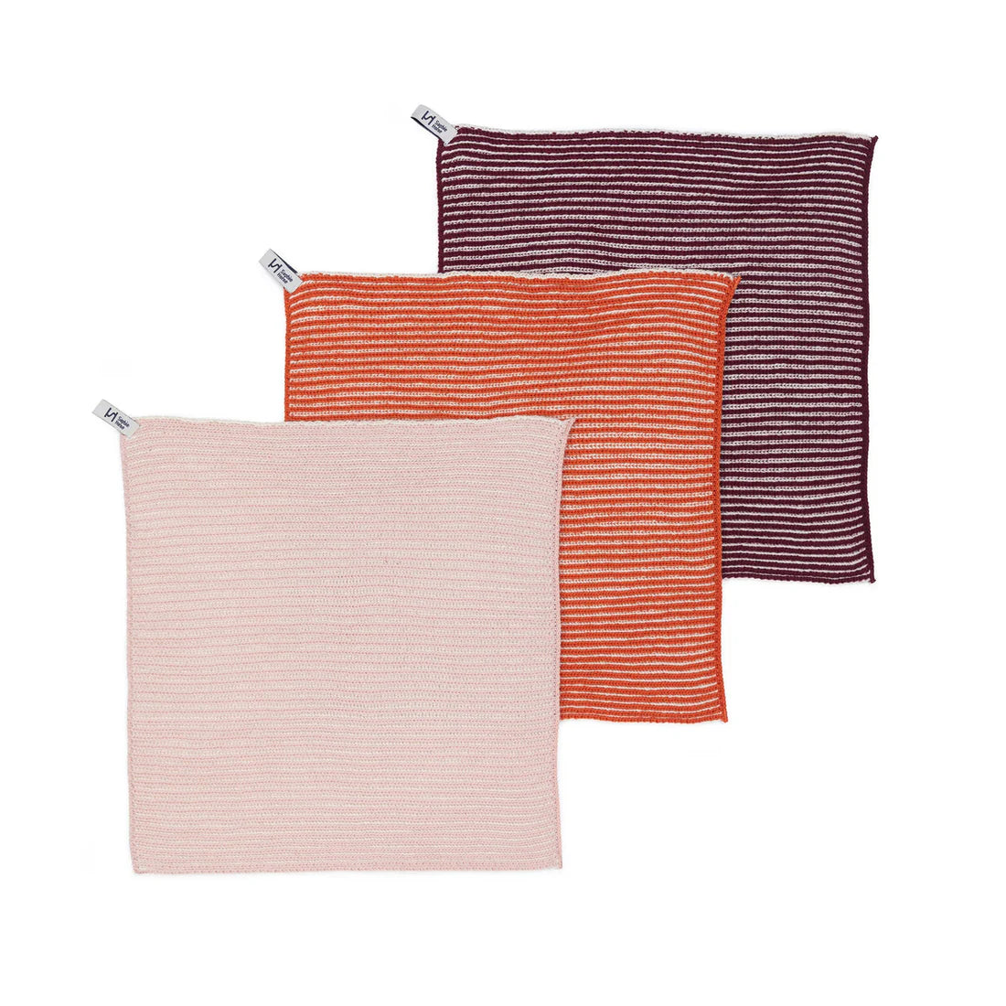 Three striped fabric bags in pink, orange, and purple on a white background