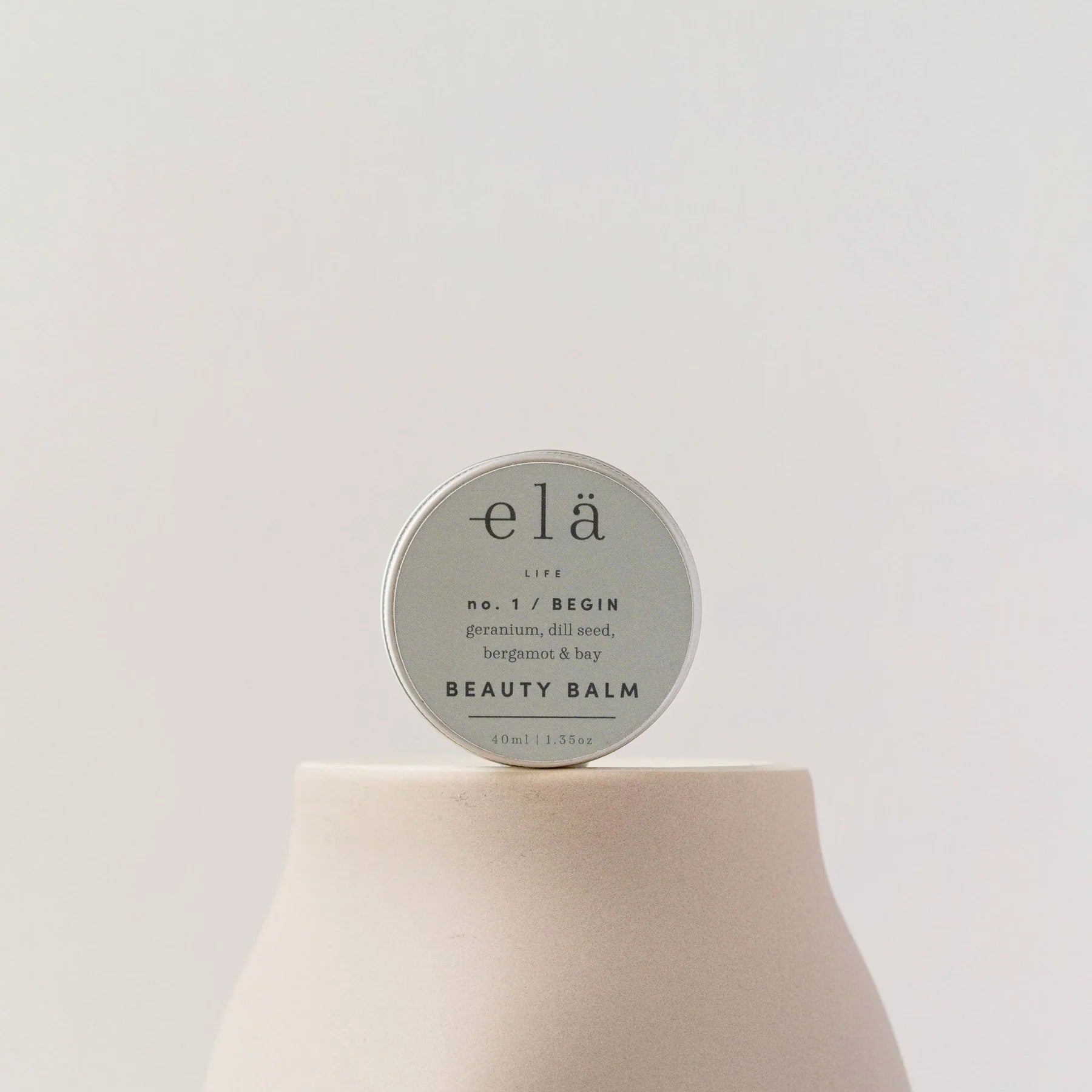 elä Life No. 1 Begin Beauty Balm in a silver tin.  Ingredients include geranium, dill seed, bergamot & bay. 40ml/1.35oz.