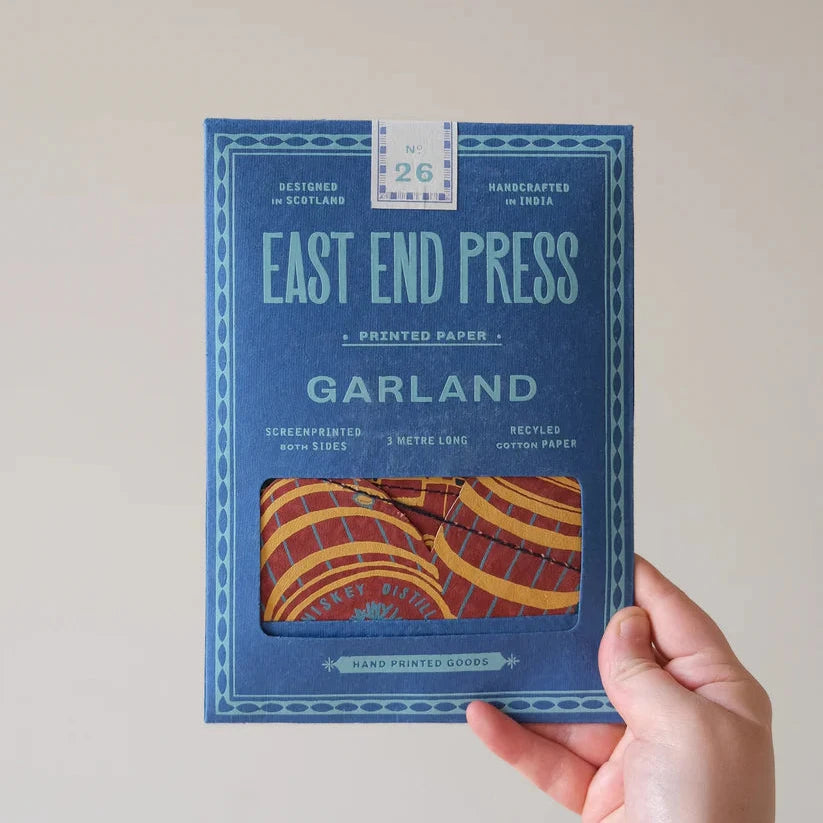 East End Press Garland: A 3-meter-long, screen-printed paper garland featuring a whiskey barrel design.