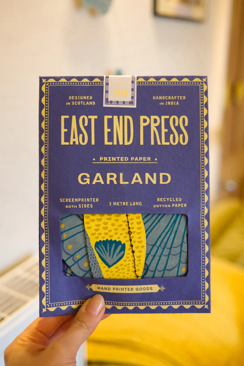 East End Press 3-meter garland. Screen-printed on both sides, recycled cotton paper.  Features a teal and yellow design.