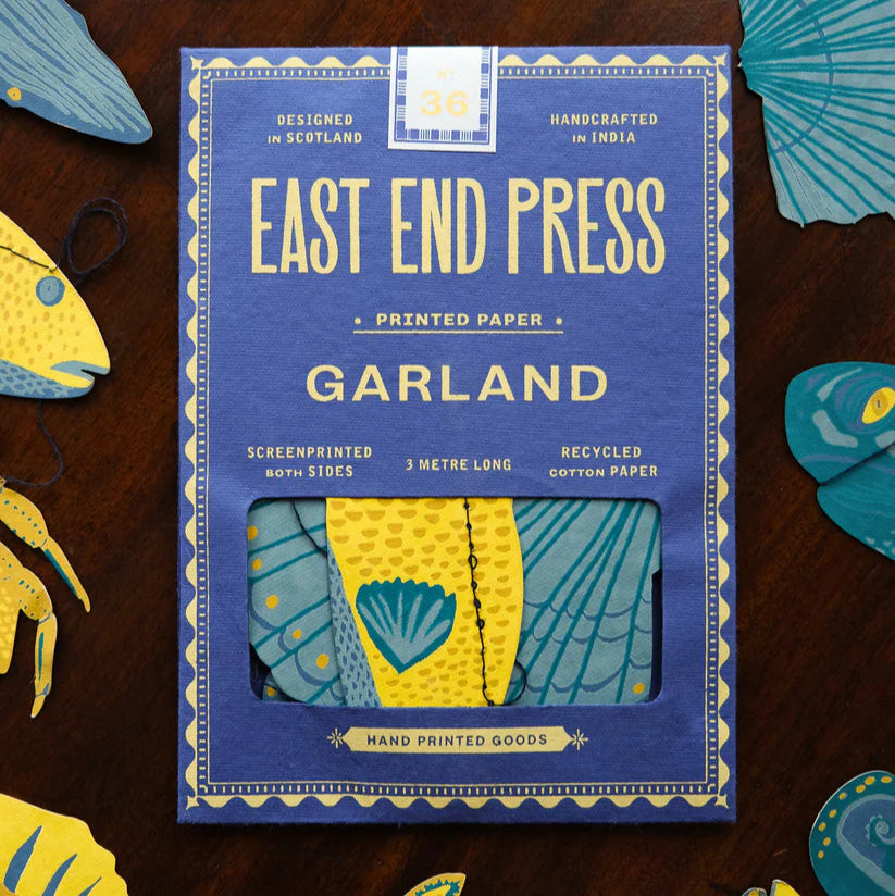 East End Press 3-meter paper garland.  Screen-printed on recycled cotton paper, featuring yellow and teal fish designs.
