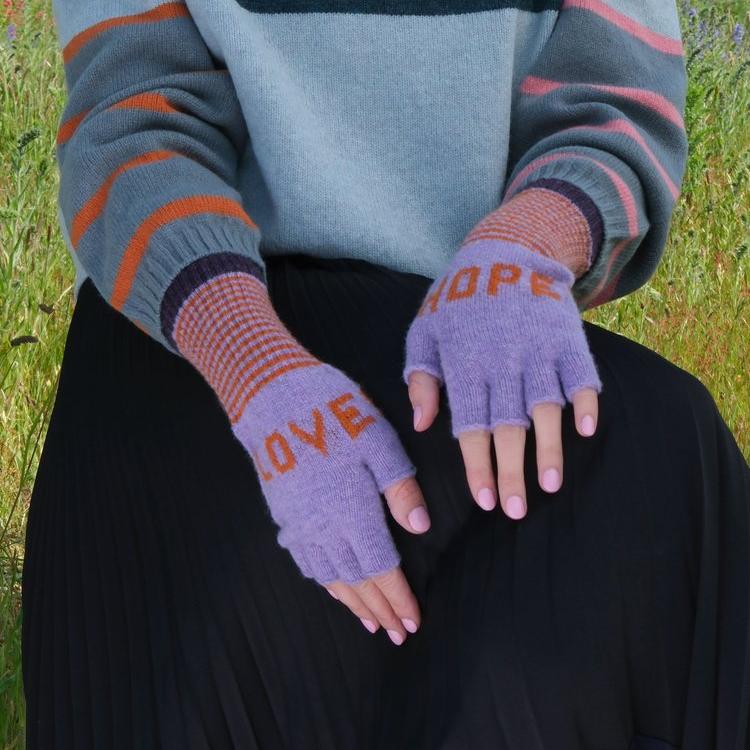 Lavender fingerless gloves with "LOVE" and "HOPE" embroidered in orange.  Striped cuffs in orange and gray.
