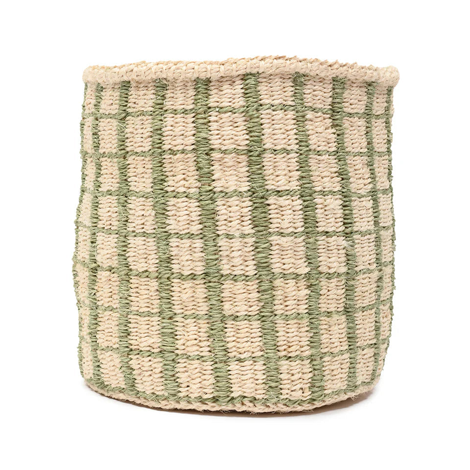 Cylindrical seagrass basket with a light beige base and a sage green grid pattern.