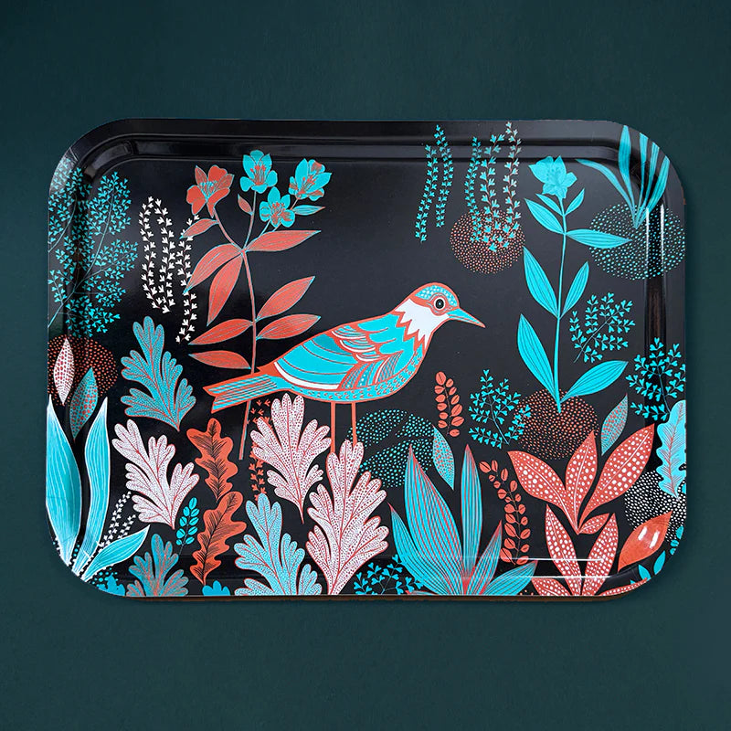 Decorative tray with a bird and floral design on a dark background