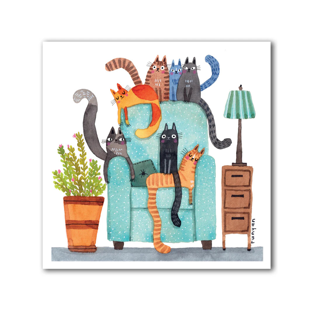 Illustration of cats on a blue armchair with a lamp and plant in the background