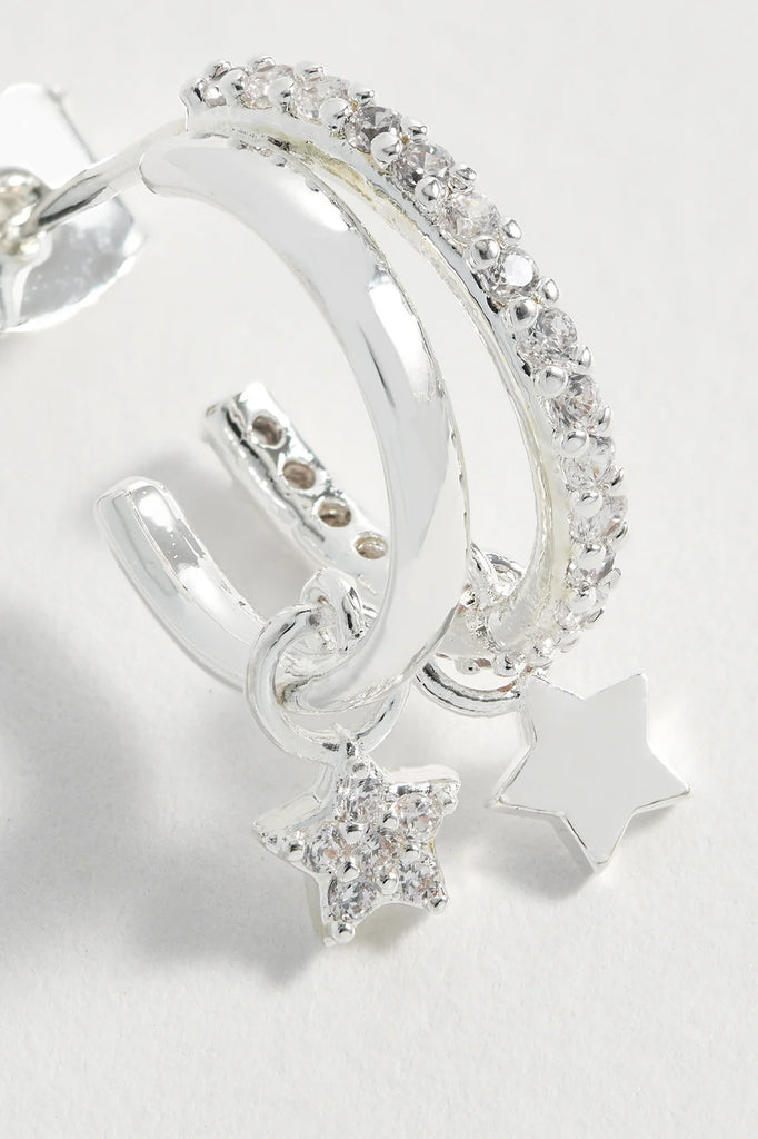 Silver double hoop earrings with clear cubic zirconia accents and dangling star charms.
