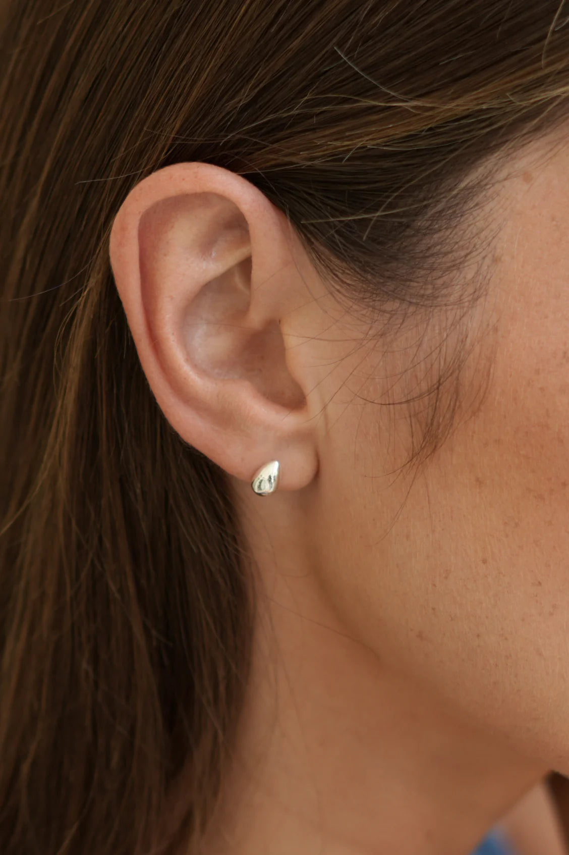 Close-up of an ear with a small earring