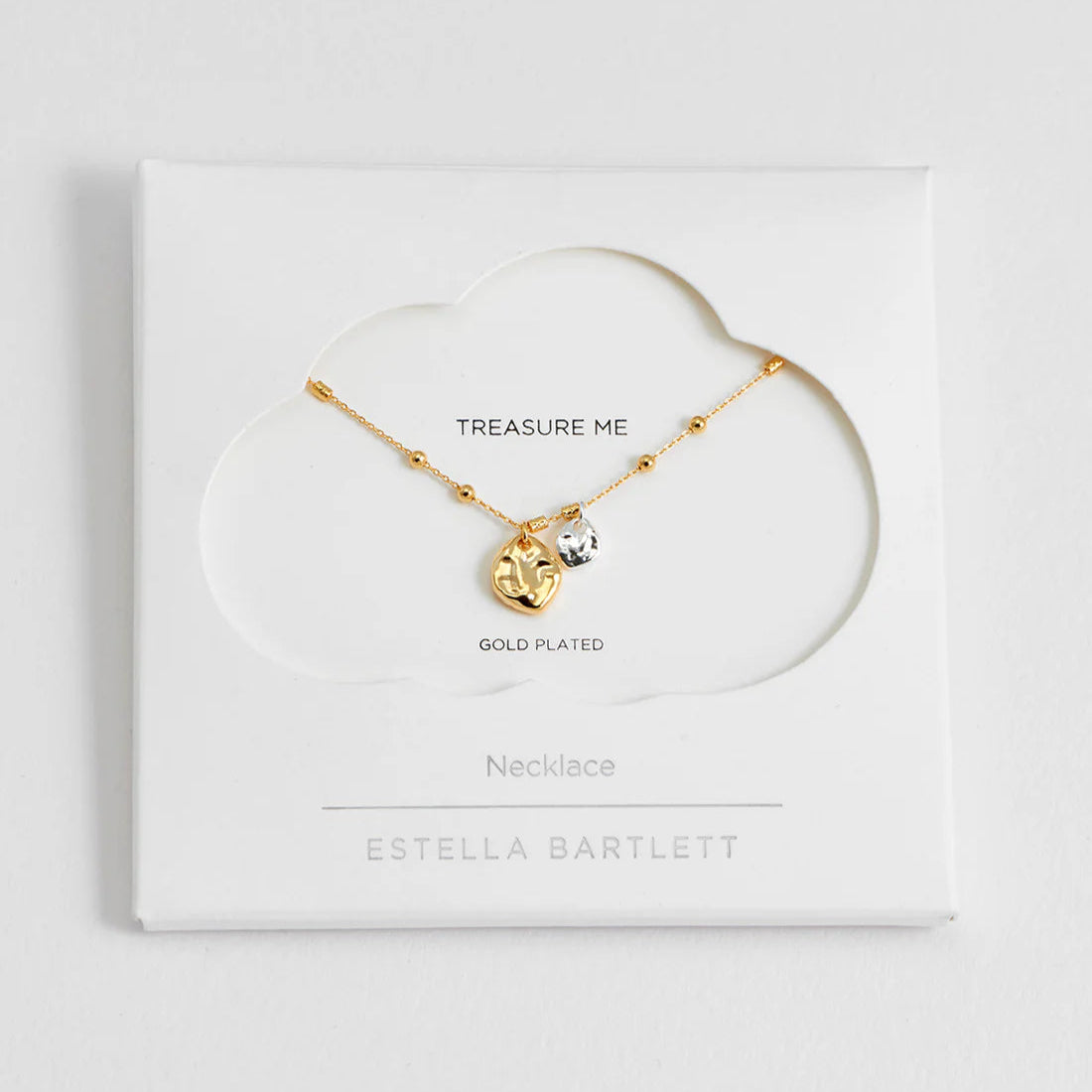Gold-plated necklace with textured heart and clear crystal charm on a delicate chain.