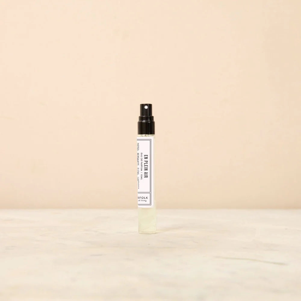 En Plein Air Eau de Parfum, a 10ml spray bottle with a black cap and minimalist label.