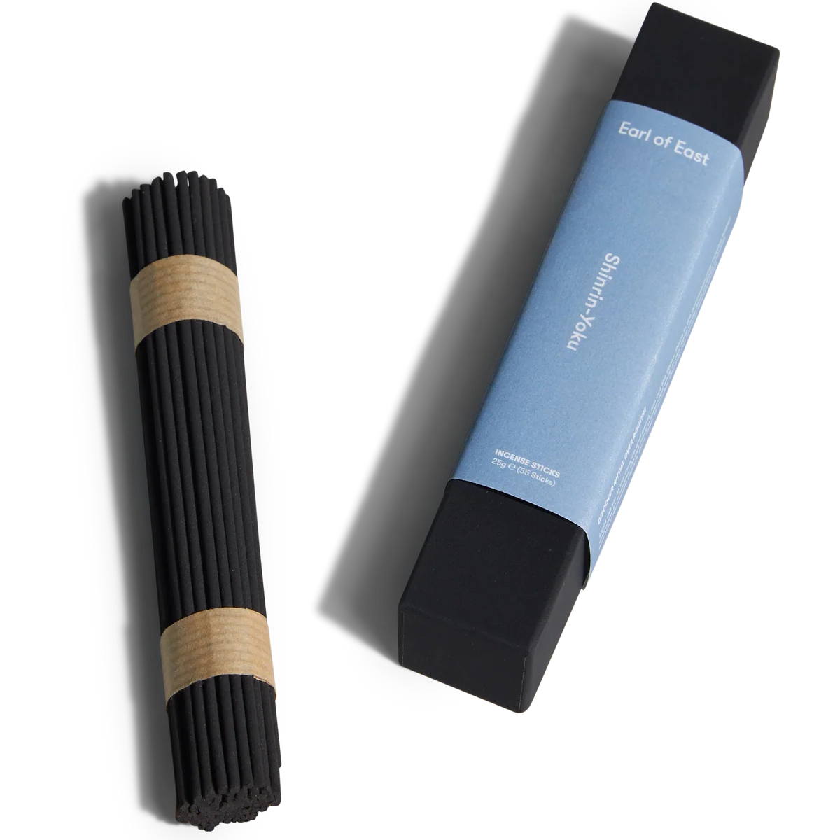 Black incense stick holder with a blue cylindrical container on a white background