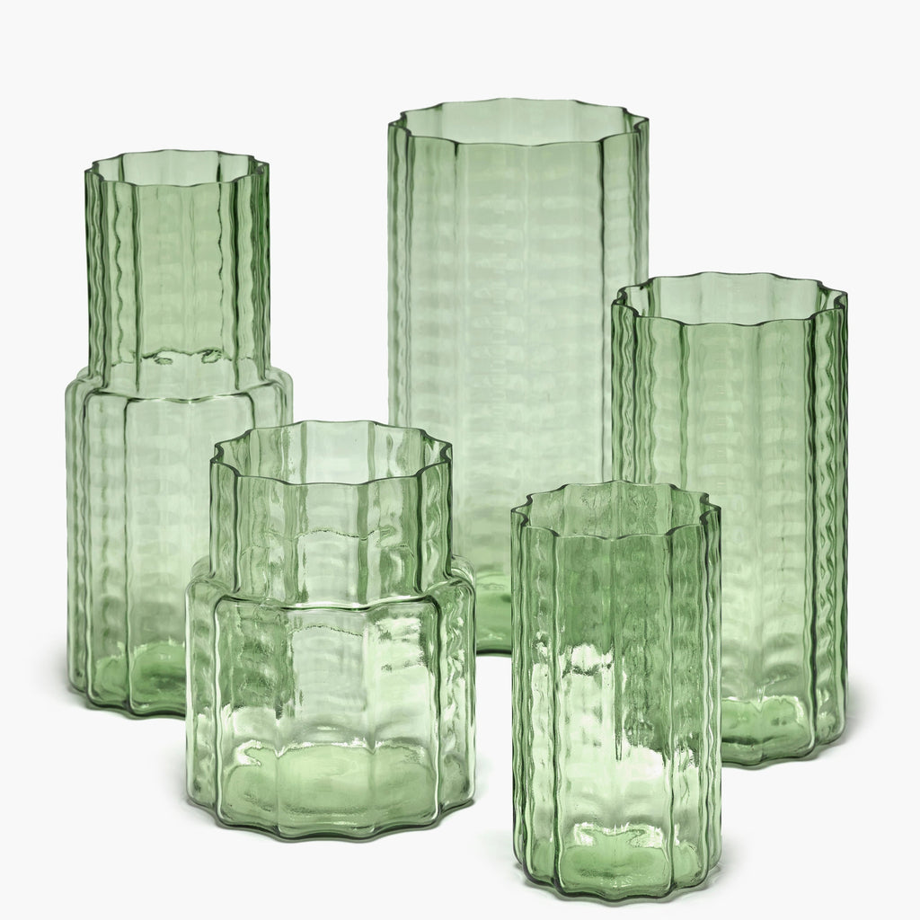 collection of light green, mouthblown glass vases, from the WAVE collection, designed by interior and furniture designer Ruben Deriemaeker, for Belgian design brand Serax.