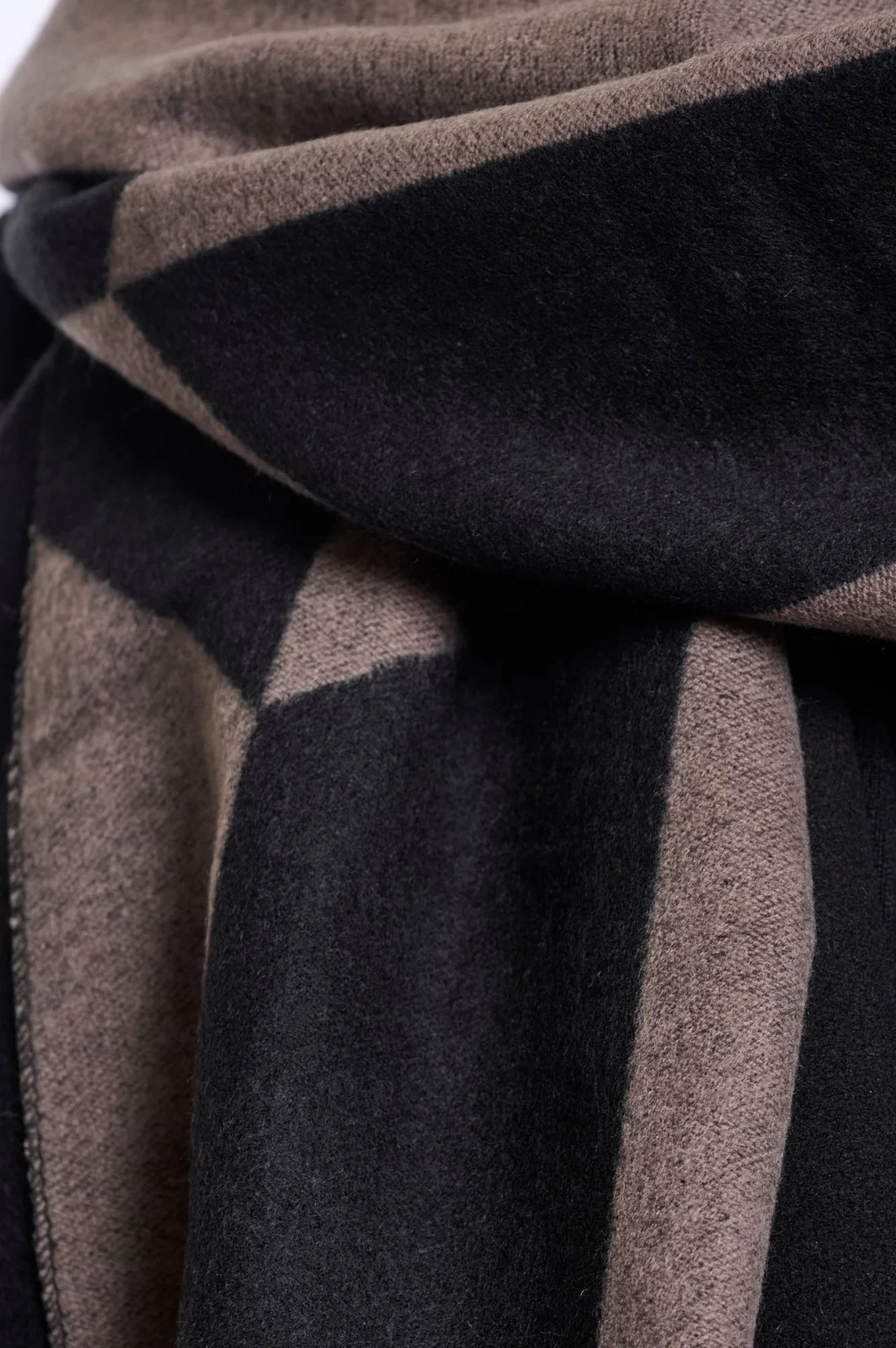 Close-up of a brown and black striped fabric texture