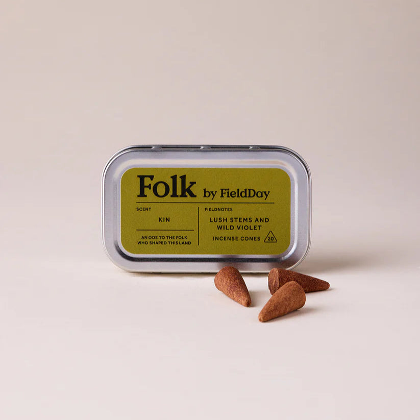 Folk by Field Day product packaging with three small brown stones on a beige background