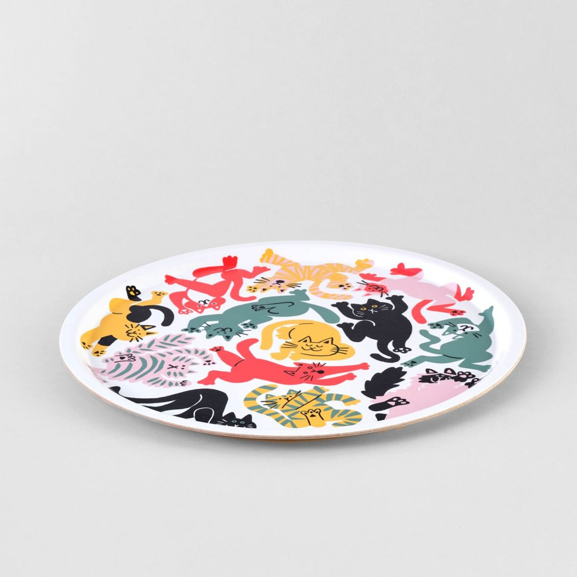 Round tray with colorful illustration of playful cats in various poses.