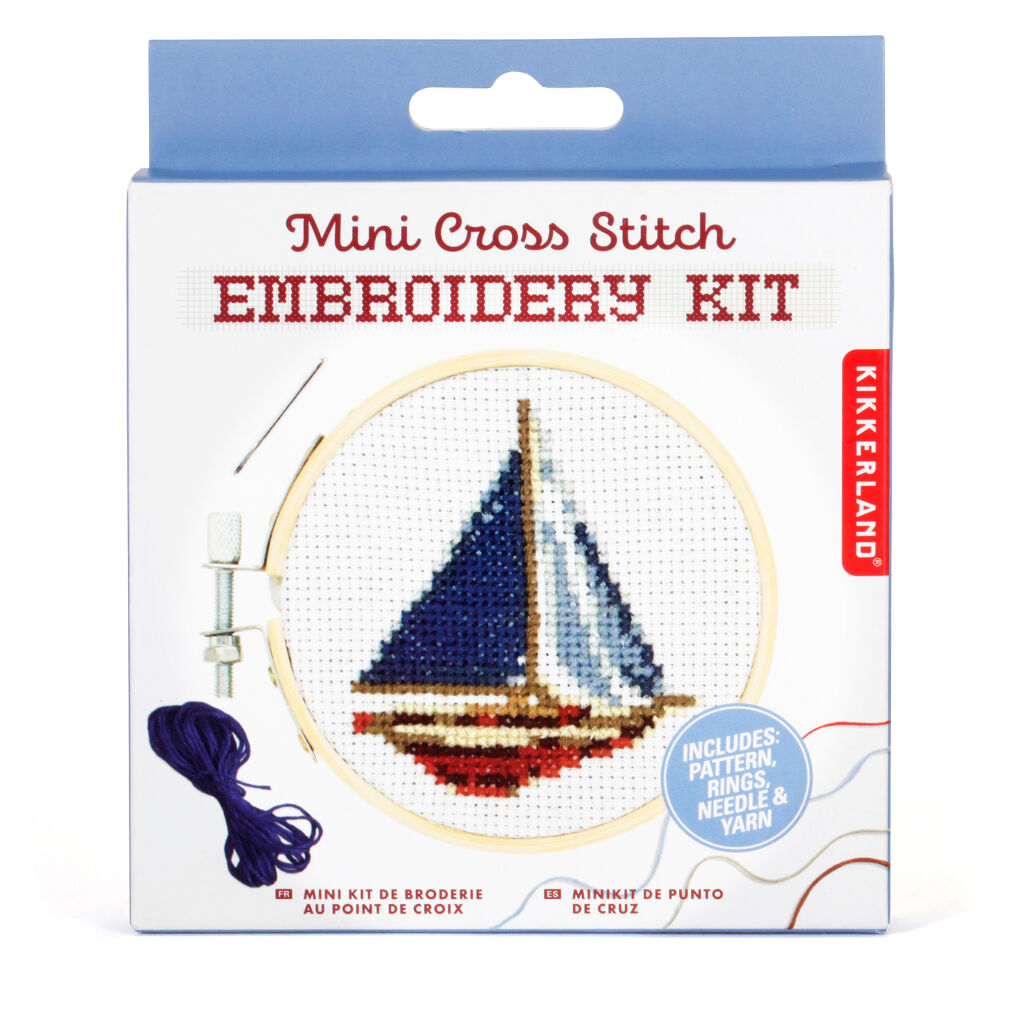 Mini cross-stitch embroidery kit featuring a sailboat design; includes pattern, rings, needle, and yarn.