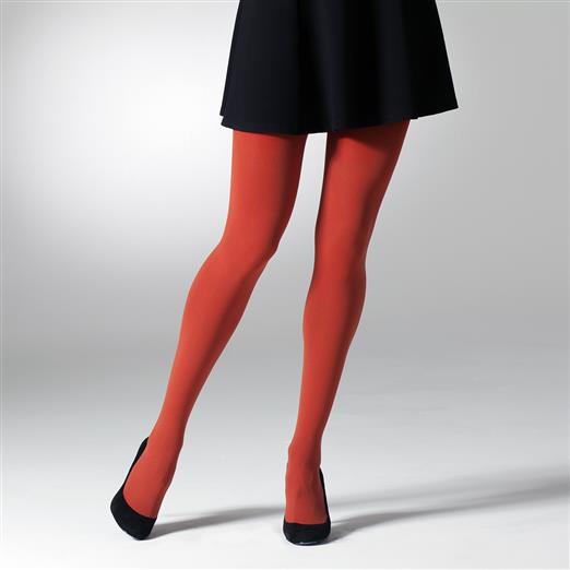 Opaque burnt orange tights on a woman's legs.