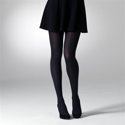 Opaque black tights on a woman's legs, shown from the knees down.