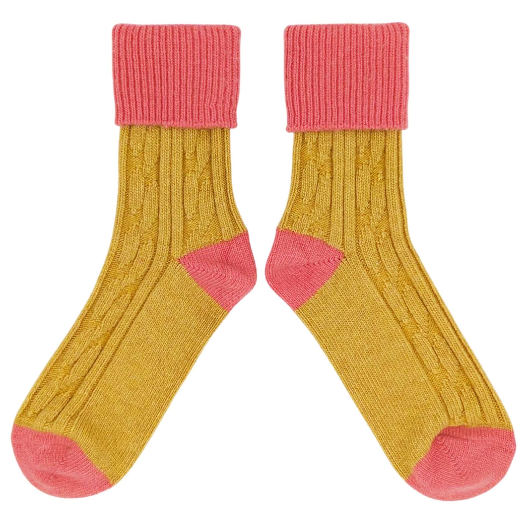 A pair of yellow cable-knit crew socks with pink cuffs, heels, and toes, displayed against a solid white background.