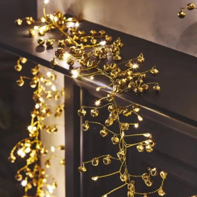 Gold bell garland with warm white LED lights.  Ideal for festive decoration.