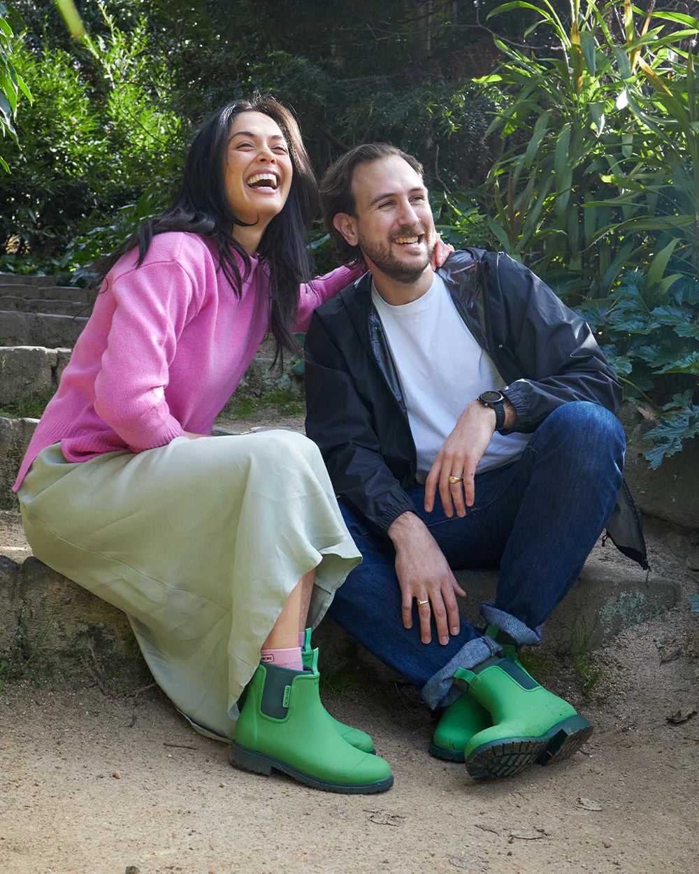 Pair of sage green rubber ankle rain boots.