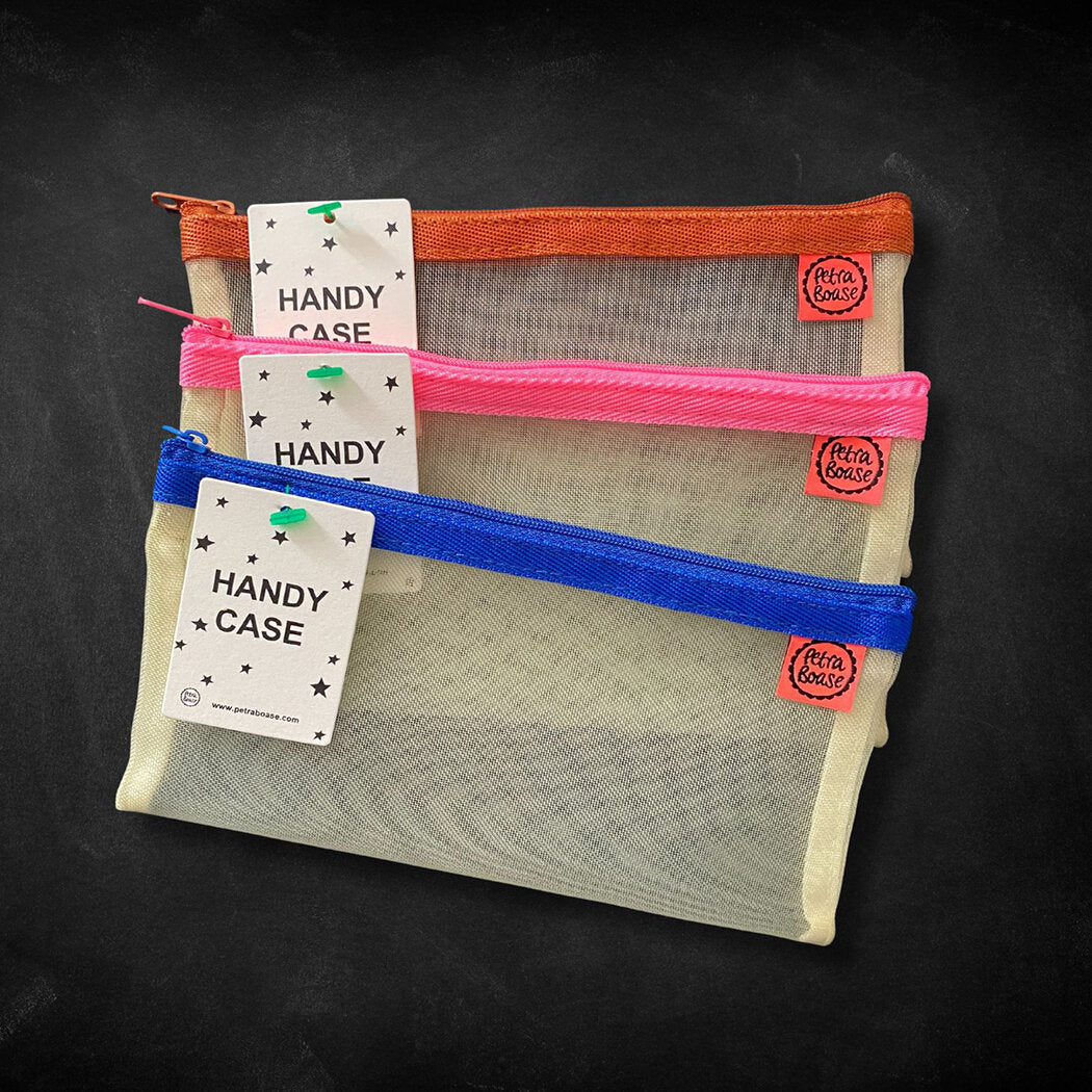 Three mesh zipper pouches in orange, pink, and blue; each labeled "Handy Case."