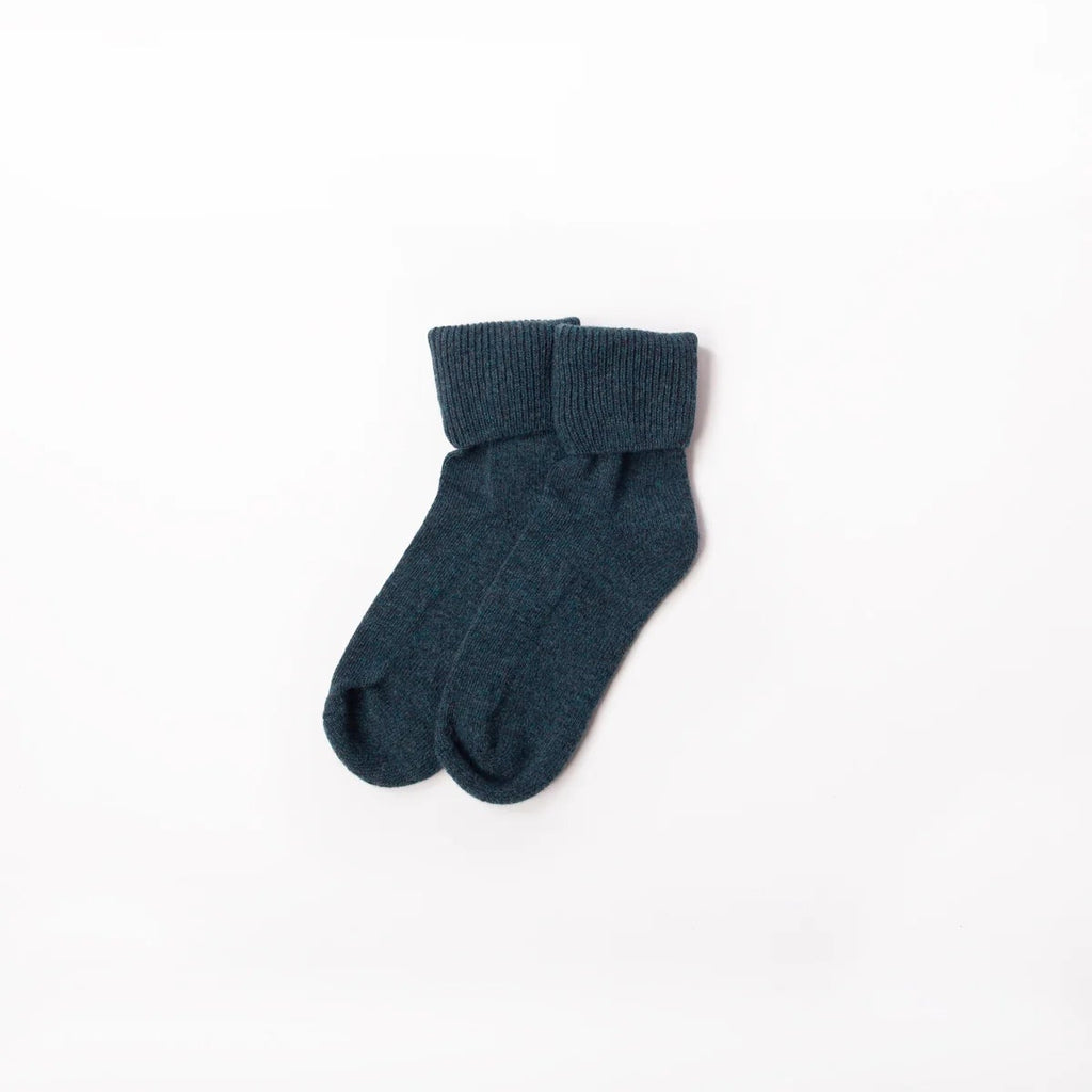 Pair of dark blue socks on a white background