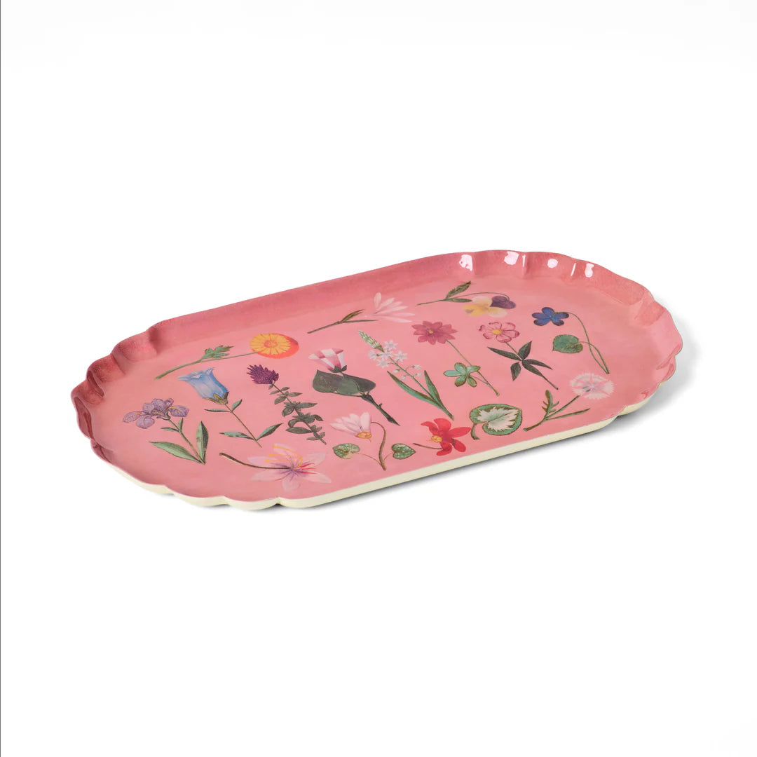 Pink tray with floral designs on a white background