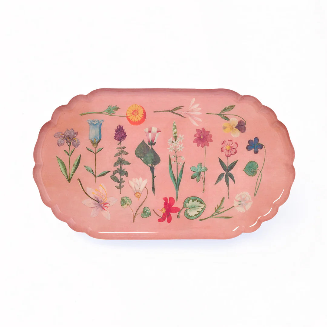 Pink tray with floral designs on a white background