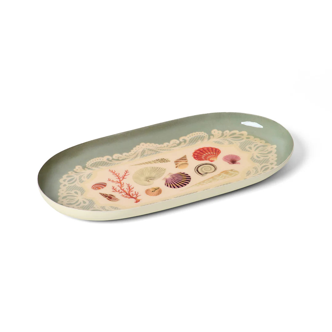 Oval-shaped tray with sea-themed design on a white background