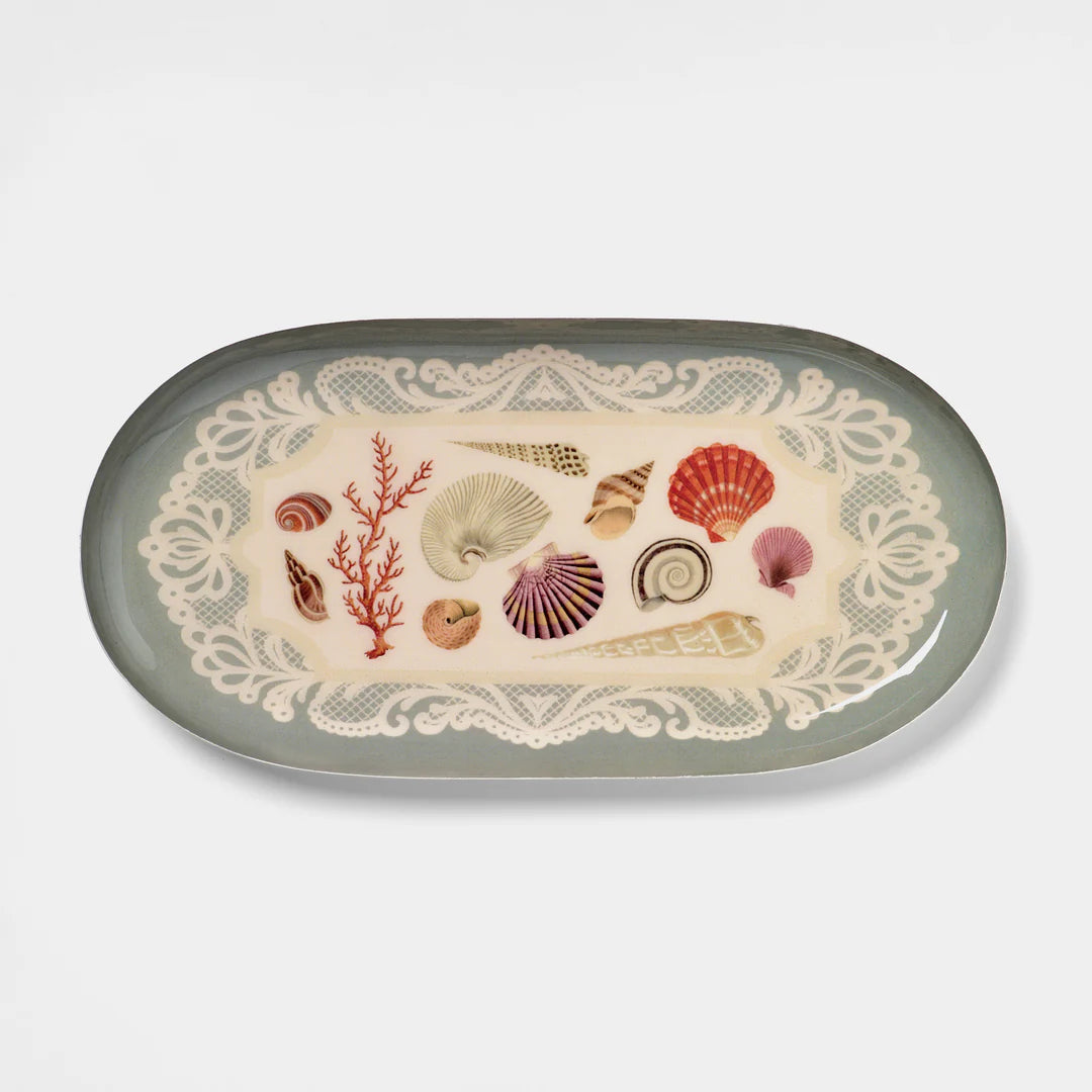 Decorative plate with sea-themed design on a light gray background