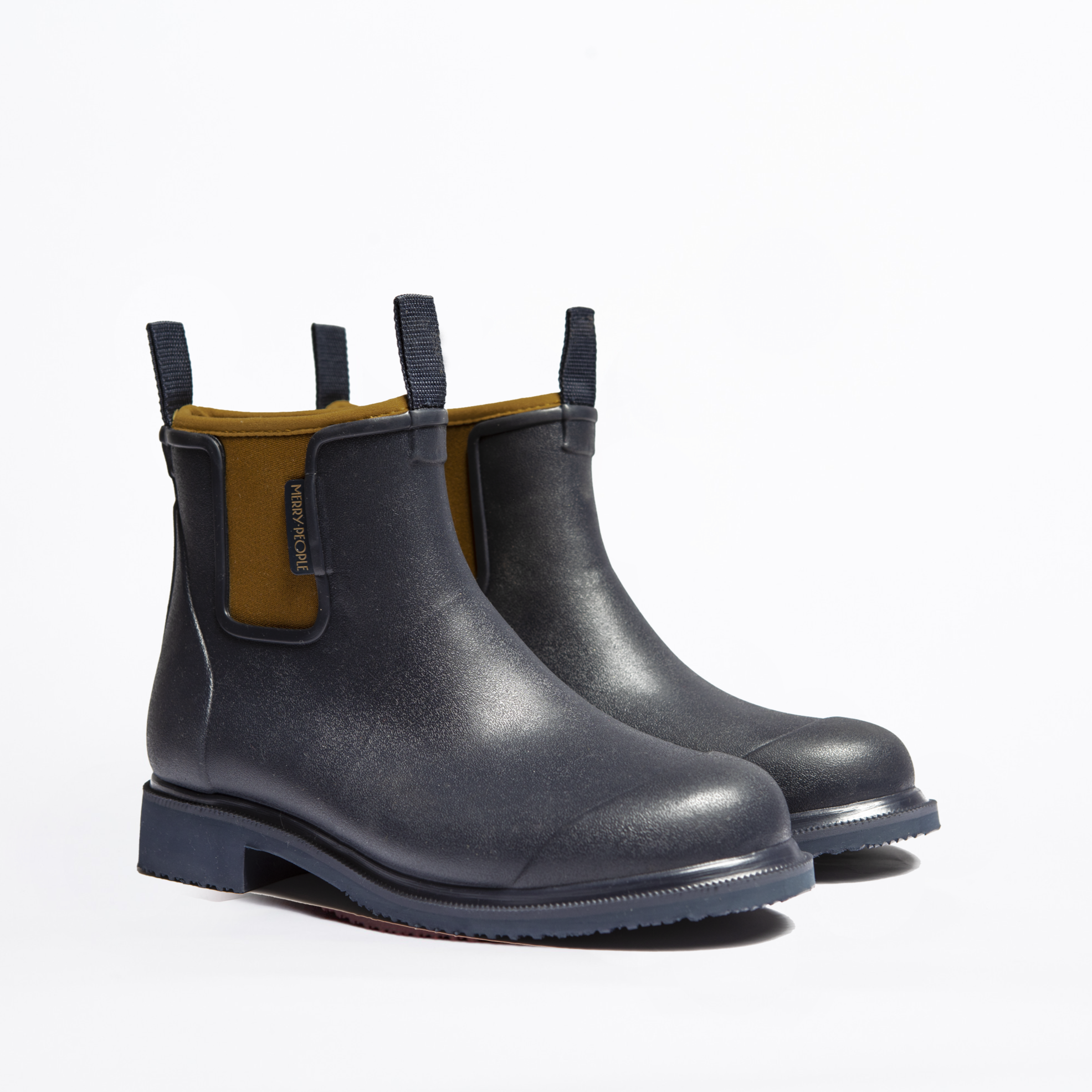 Pair of dark navy blue rubber ankle boots with a textured surface and olive green inner lining.