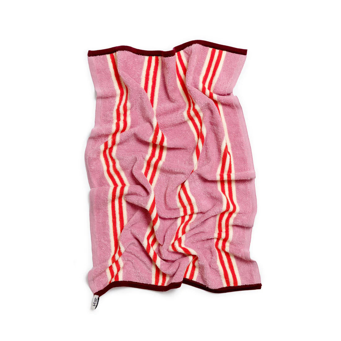 Pink towel with red and white stripes on a white background