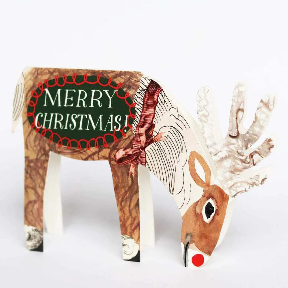 Cardboard reindeer with 'Merry Christmas' text on a white background