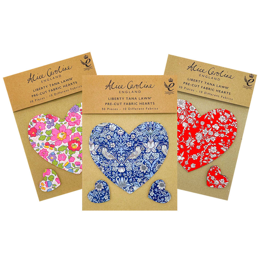 Three packs of 30 pre-cut Liberty Tana Lawn fabric hearts; each pack features ten different floral designs.