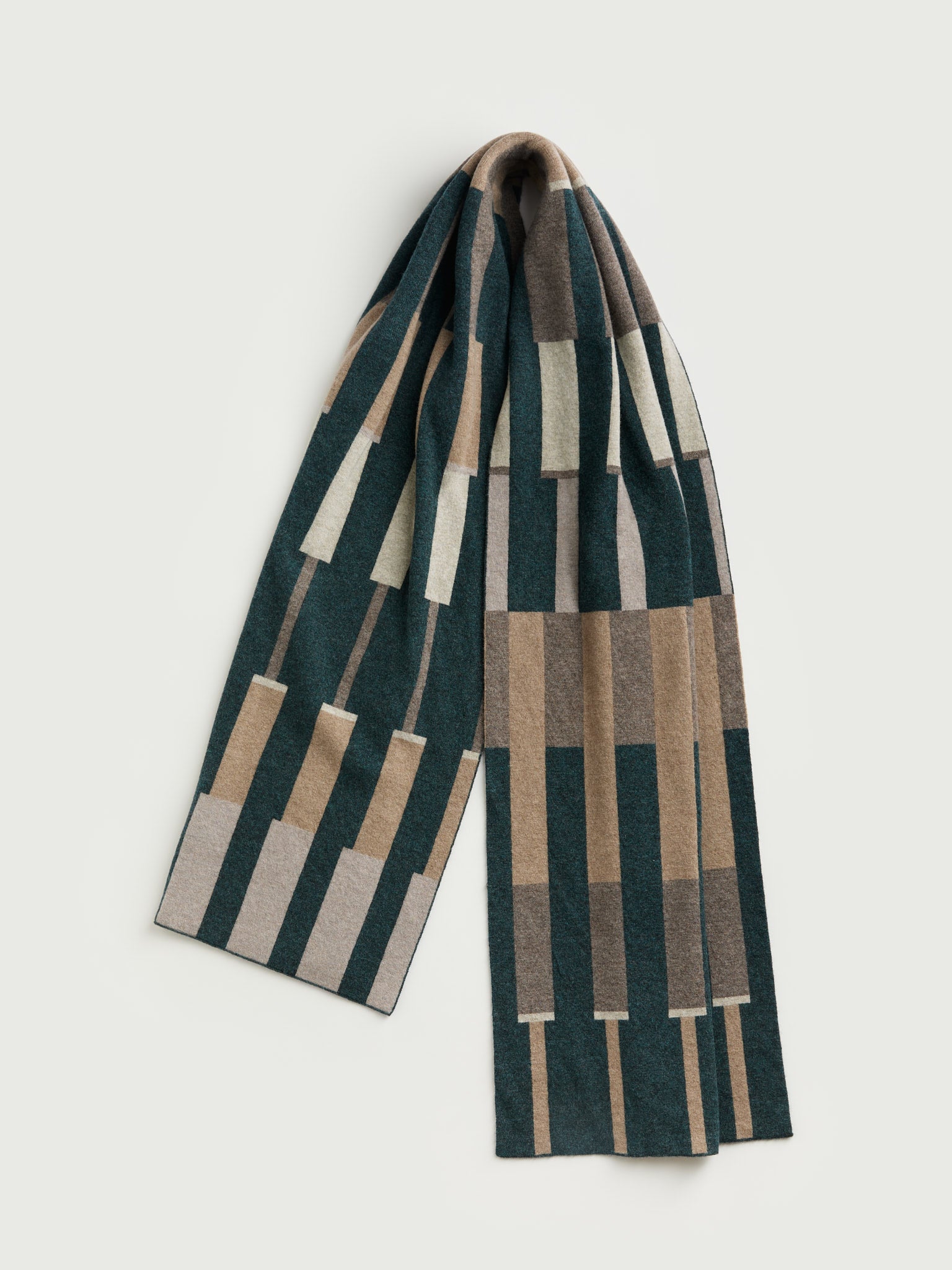 Plaid scarf with geometric pattern on a light gray background