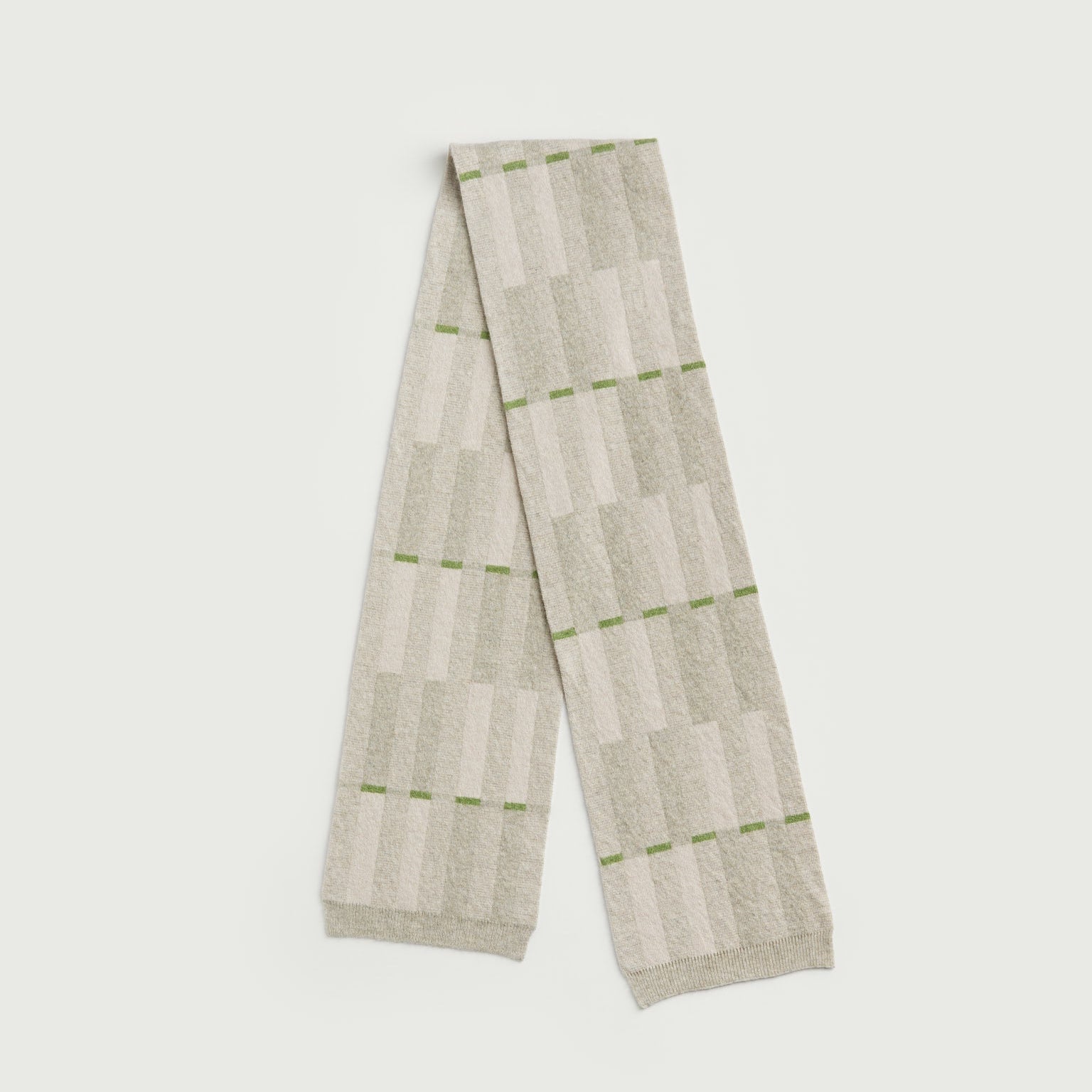 Striped scarf with green accents on a white background