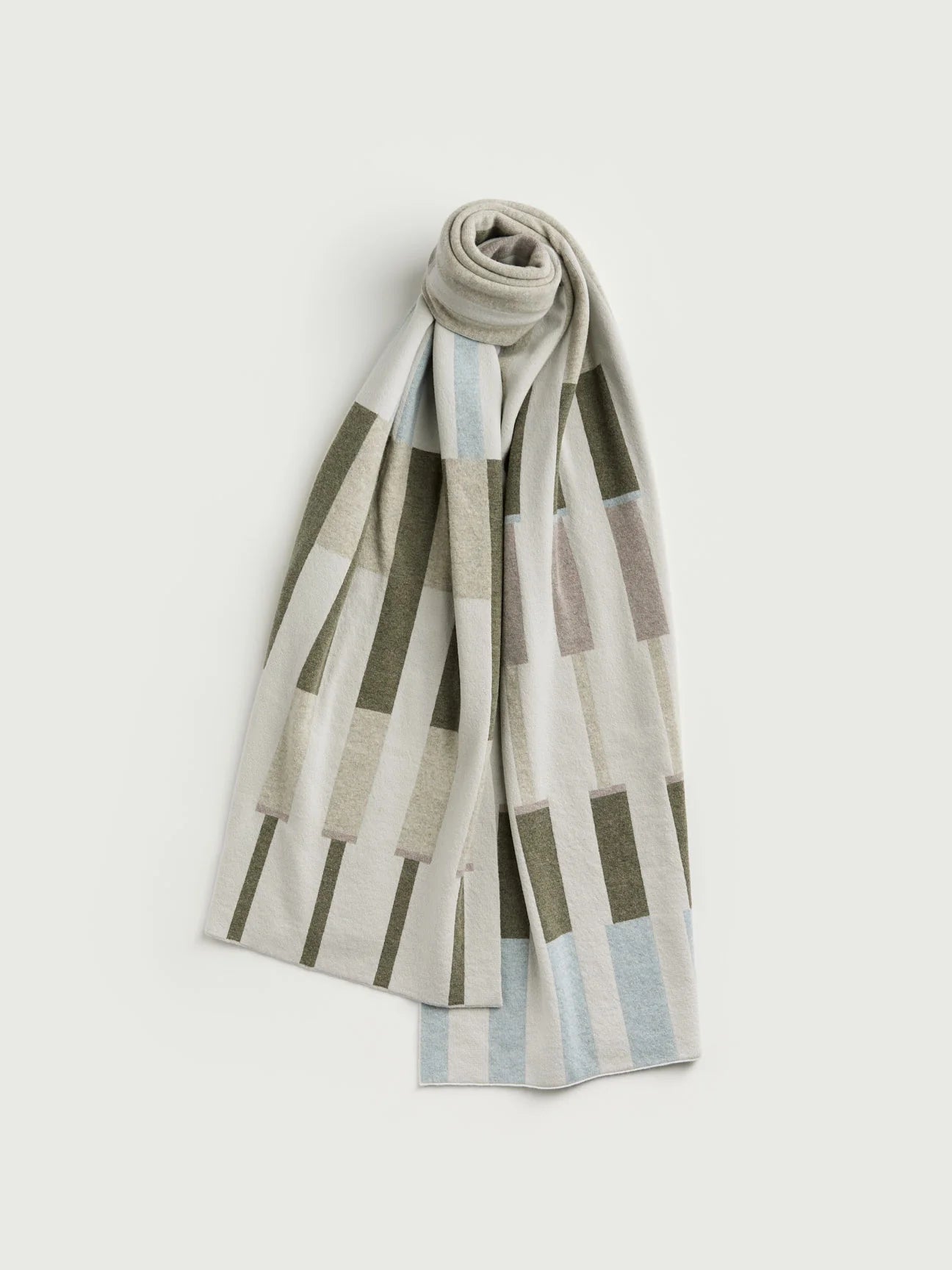 Striped scarf with geometric pattern on a light gray background