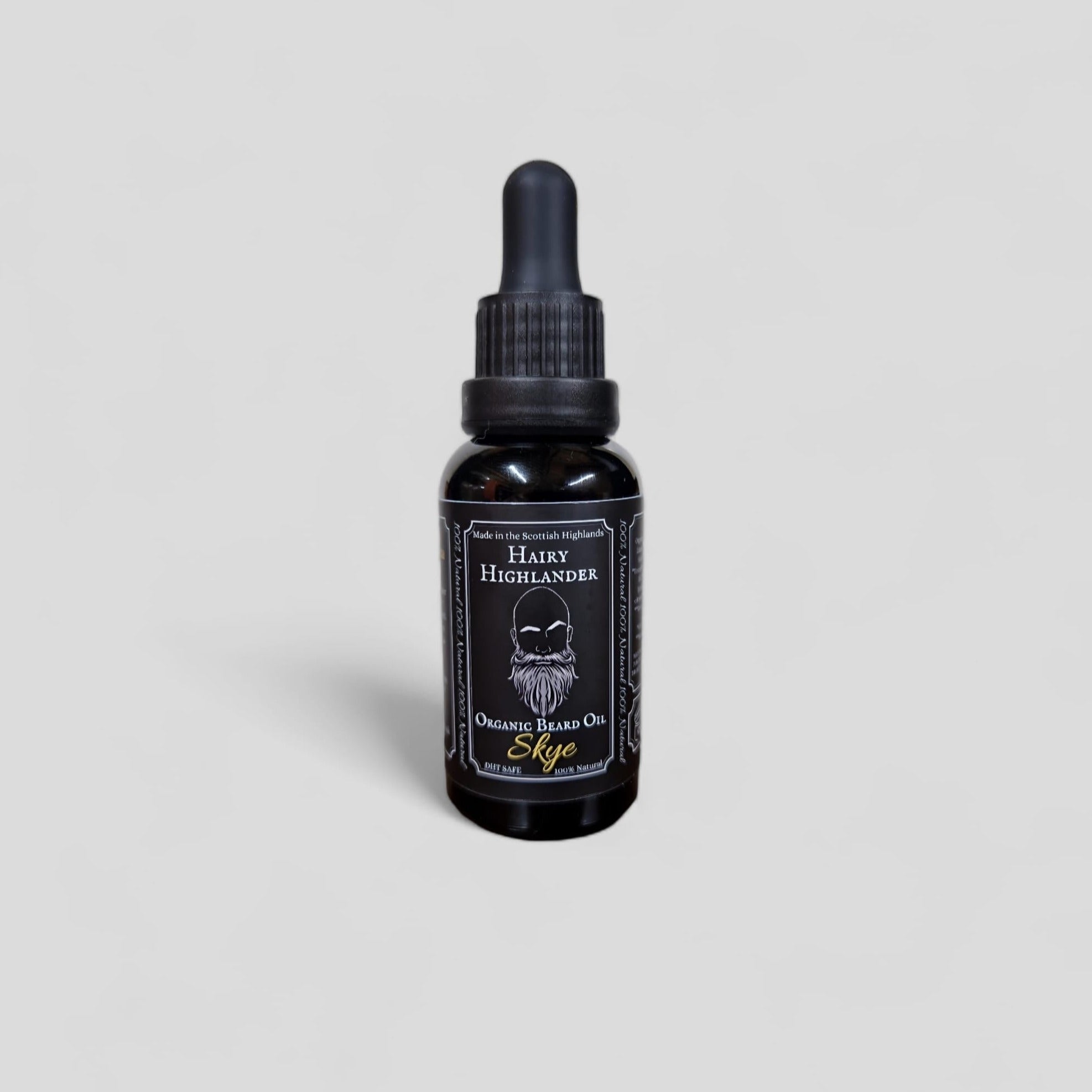 Black bottle of Hairy Highlander Skye Organic Beard Oil with dropper top.  Label features a bearded man illustration.