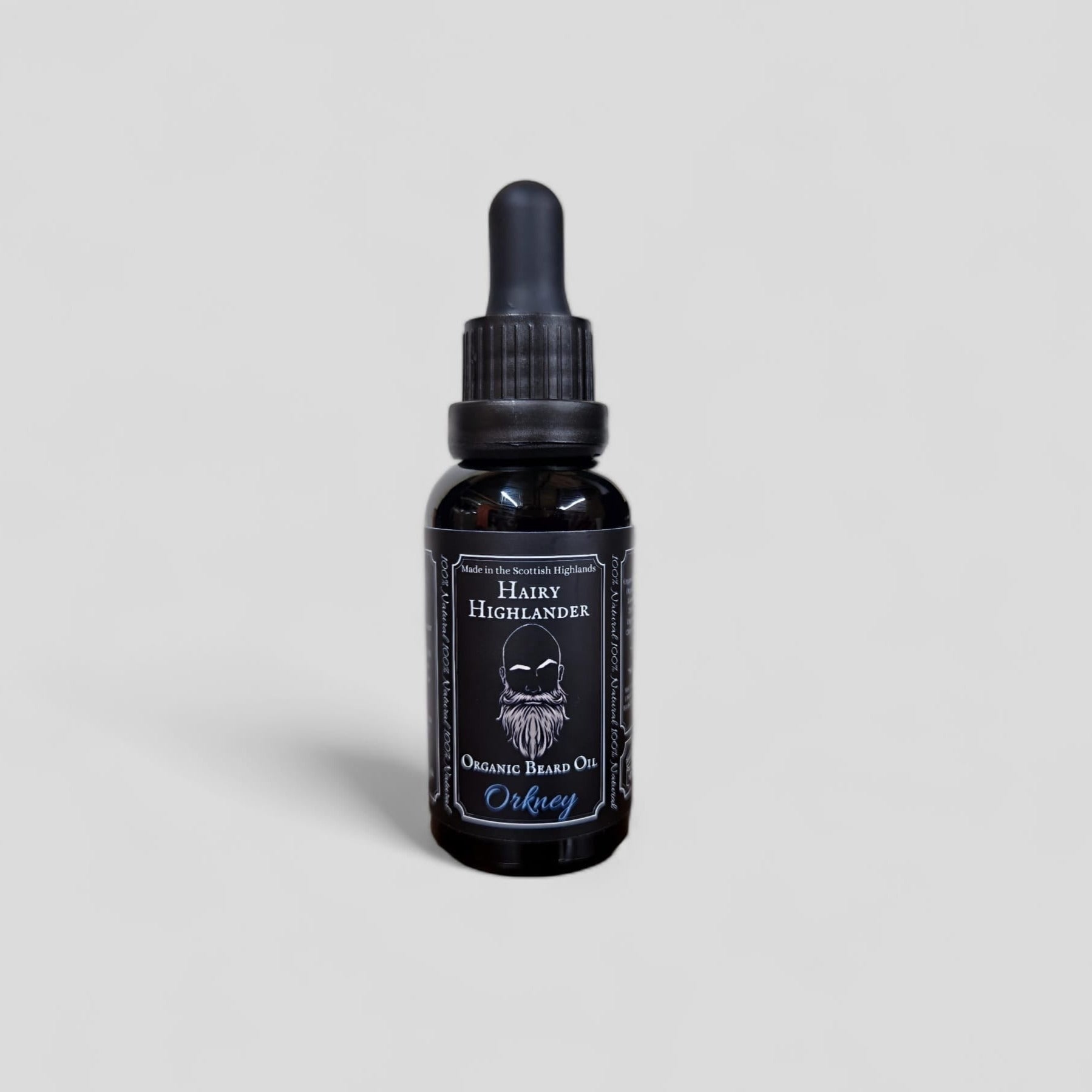 Black bottle of Hairy Highlander Orkney Organic Beard Oil with dropper top.