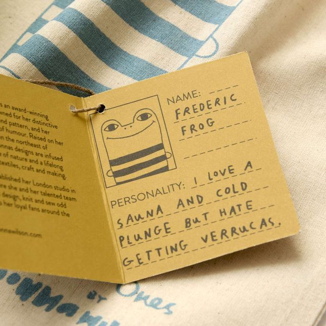 Card with character details on a striped fabric background