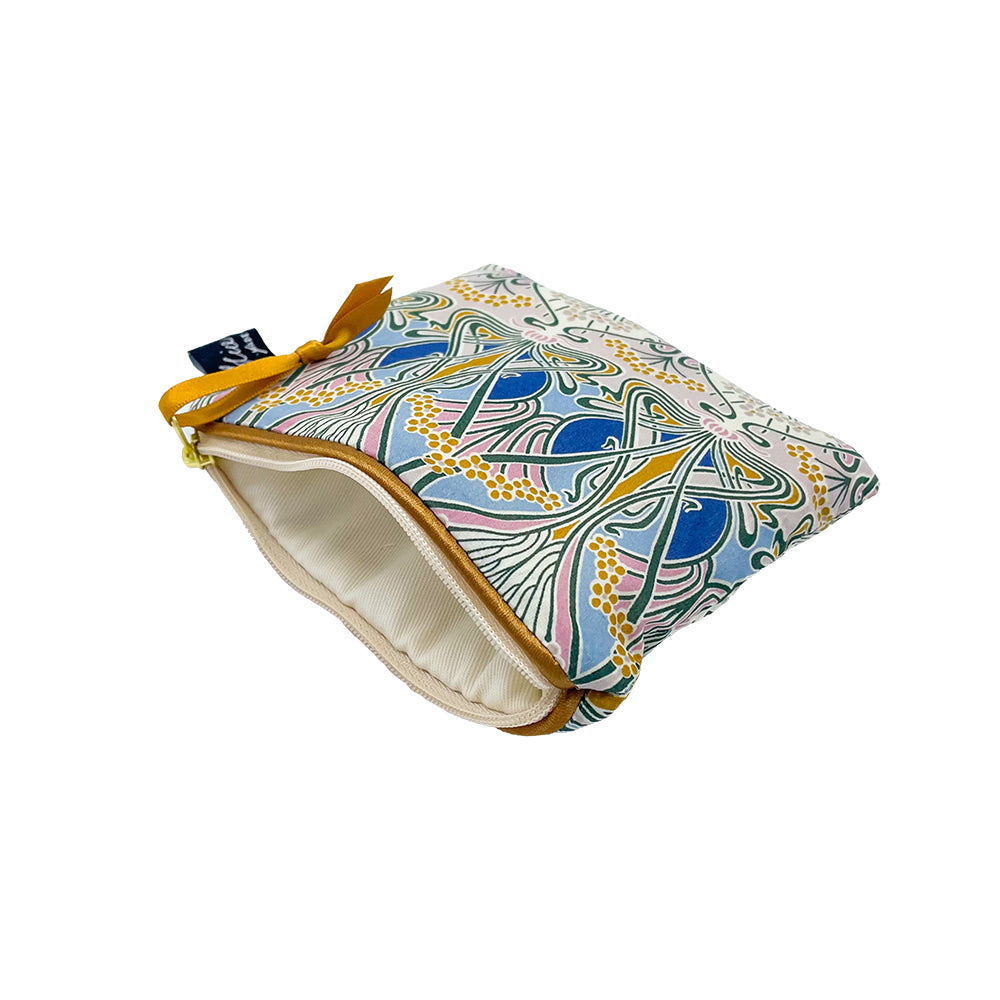 Small zippered pouch with a cream interior and an art nouveau-style floral print in blues, pinks, and golds.